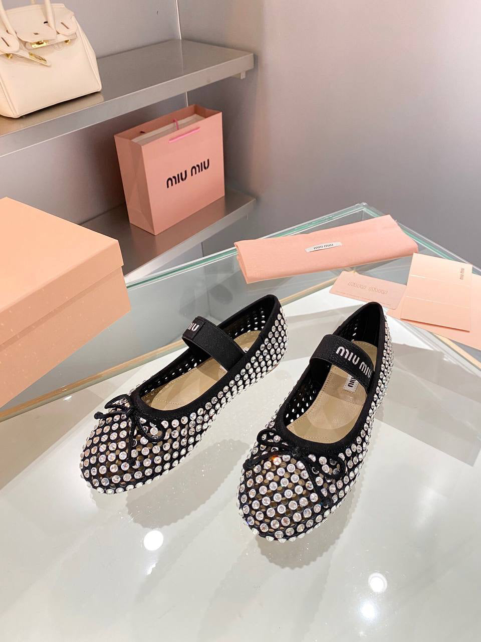 Miu Miu Logo-strap embellished ballet flats
