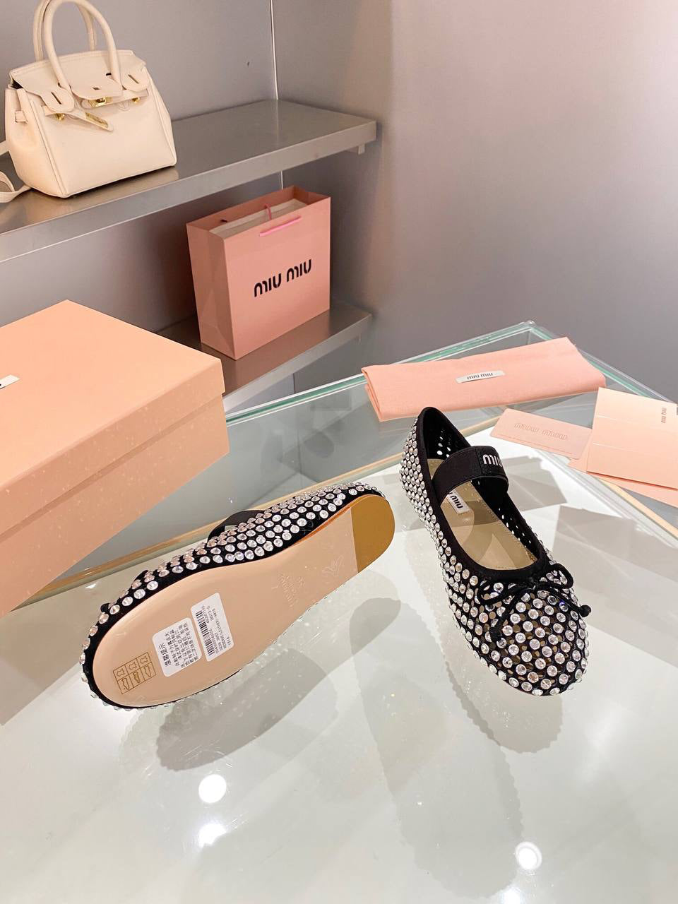 Miu Miu Logo-strap embellished ballet flats