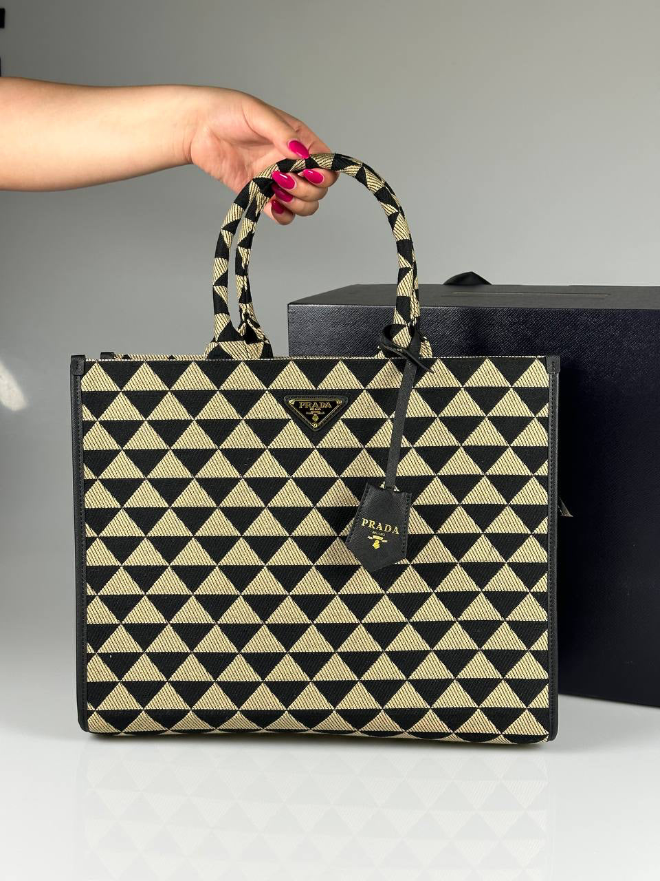 Prada Symbole embroidered fabric handbag
