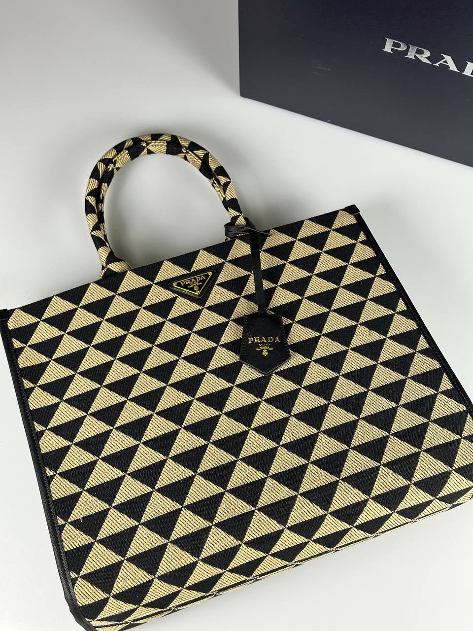 Prada Symbole embroidered fabric handbag