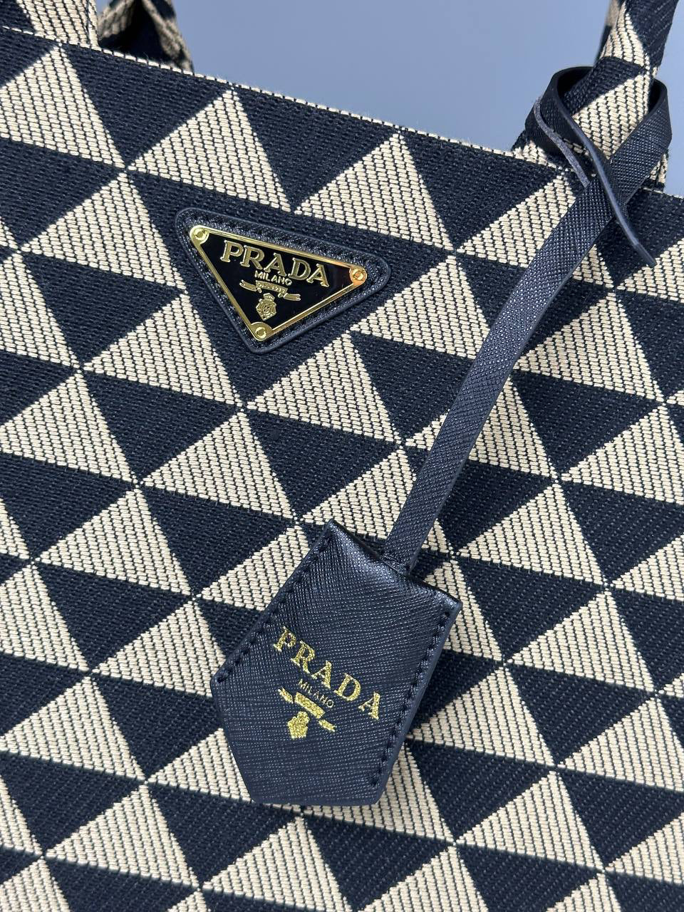 Prada Symbole embroidered fabric handbag