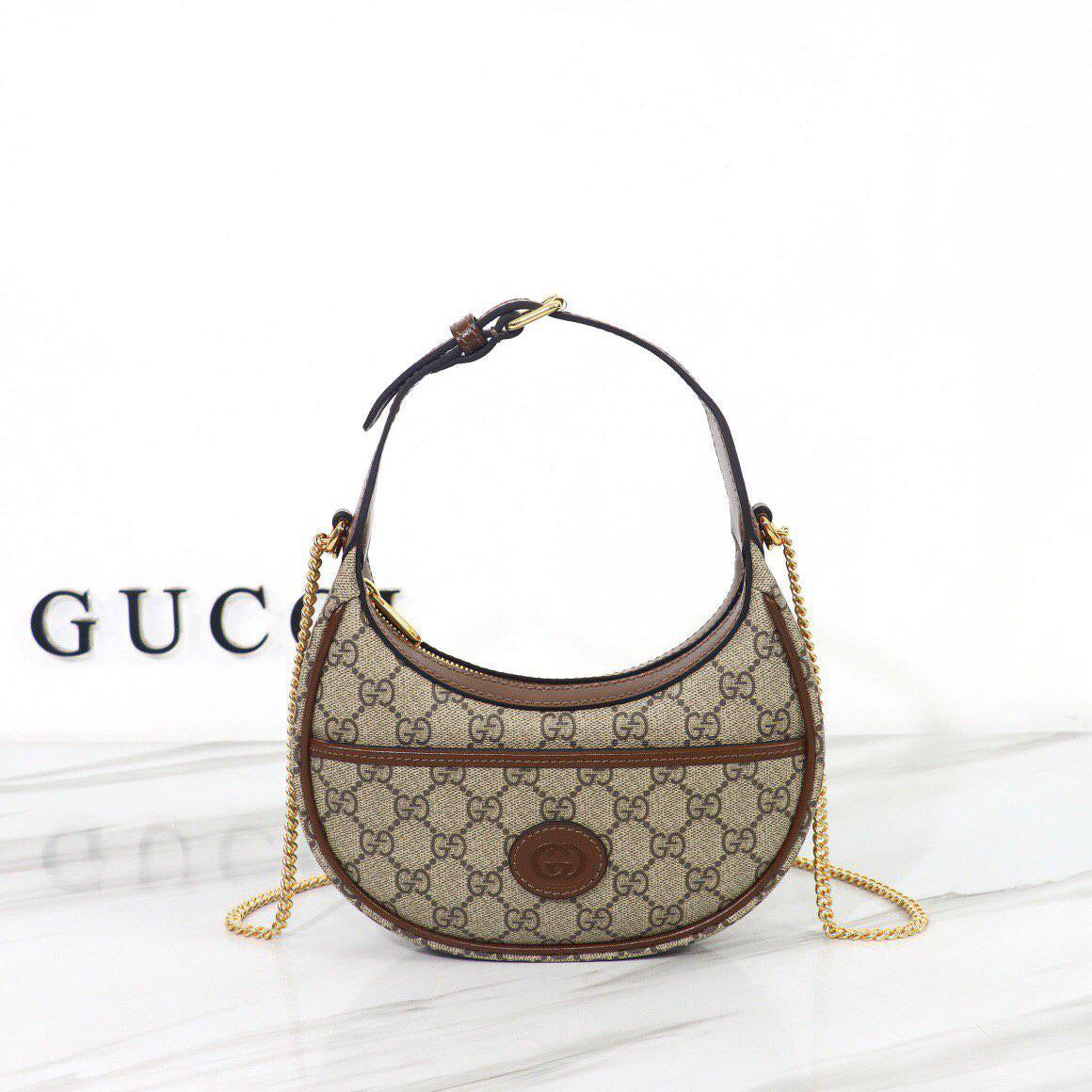 Gucci GG half-moon mini bag